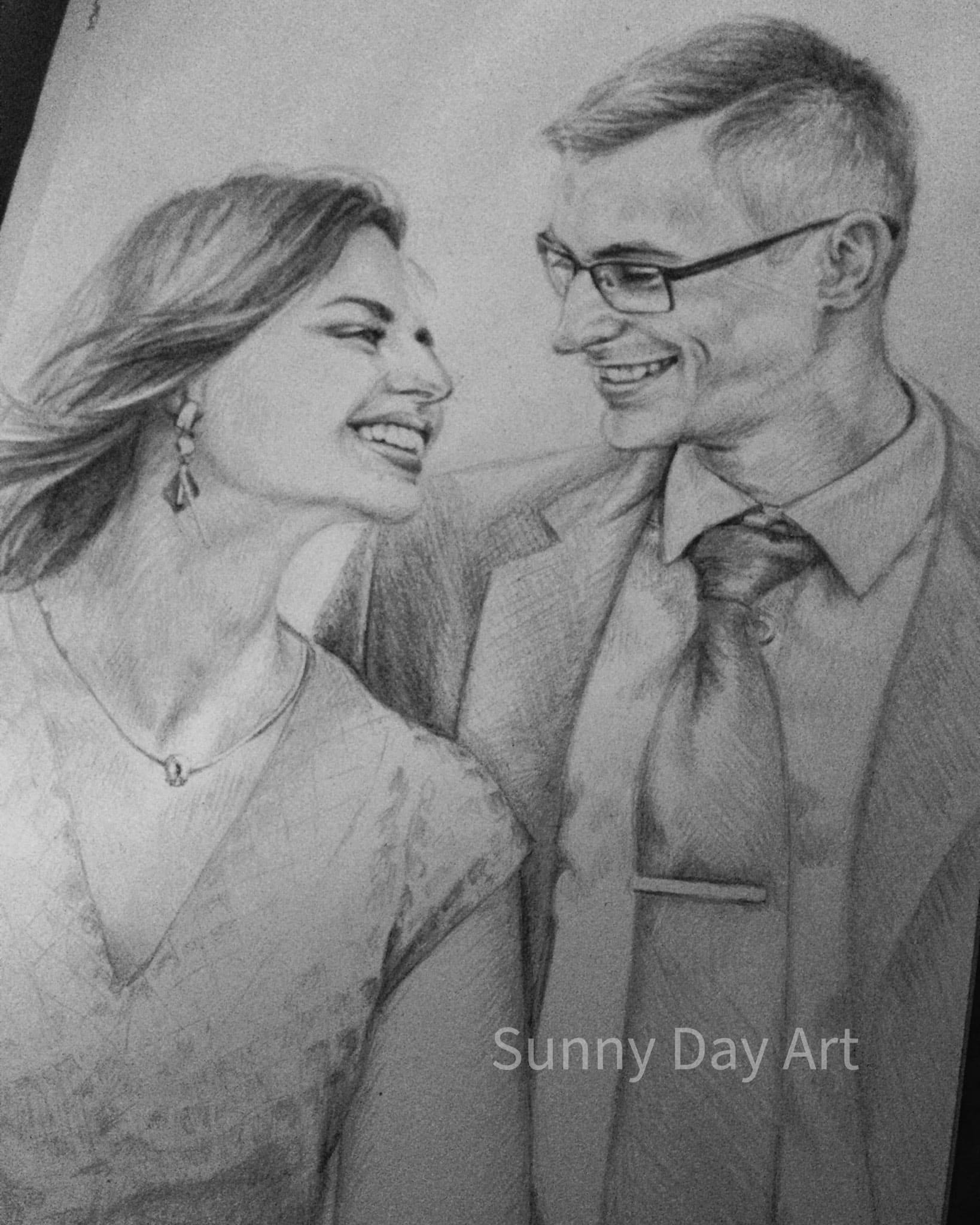 Portrait of a young couple, dark-haired girl in a dress, man in a suit and glasses, smiling at each other.