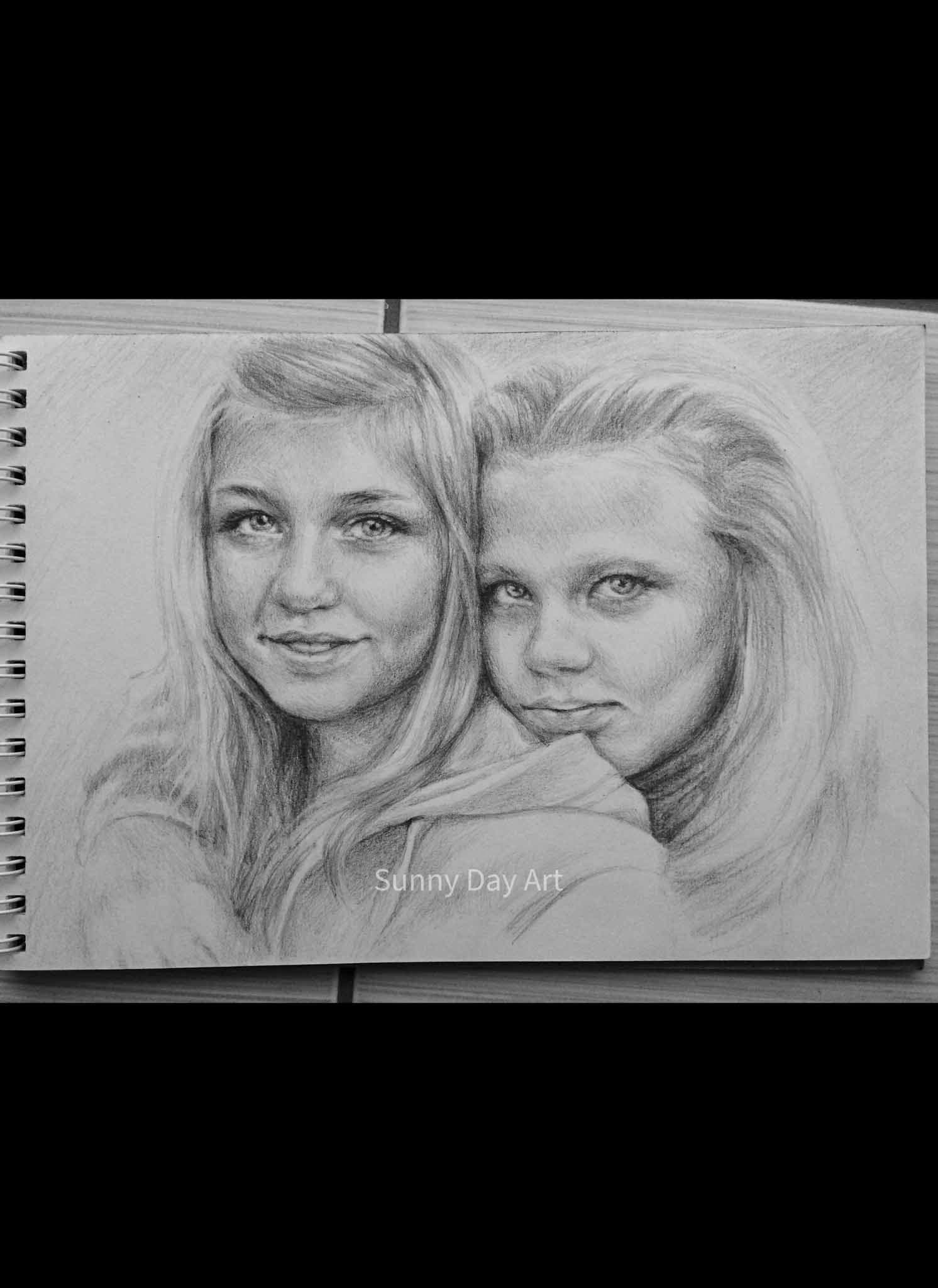Portrait of two teenage blonde girls, hugging, looking at the camera.