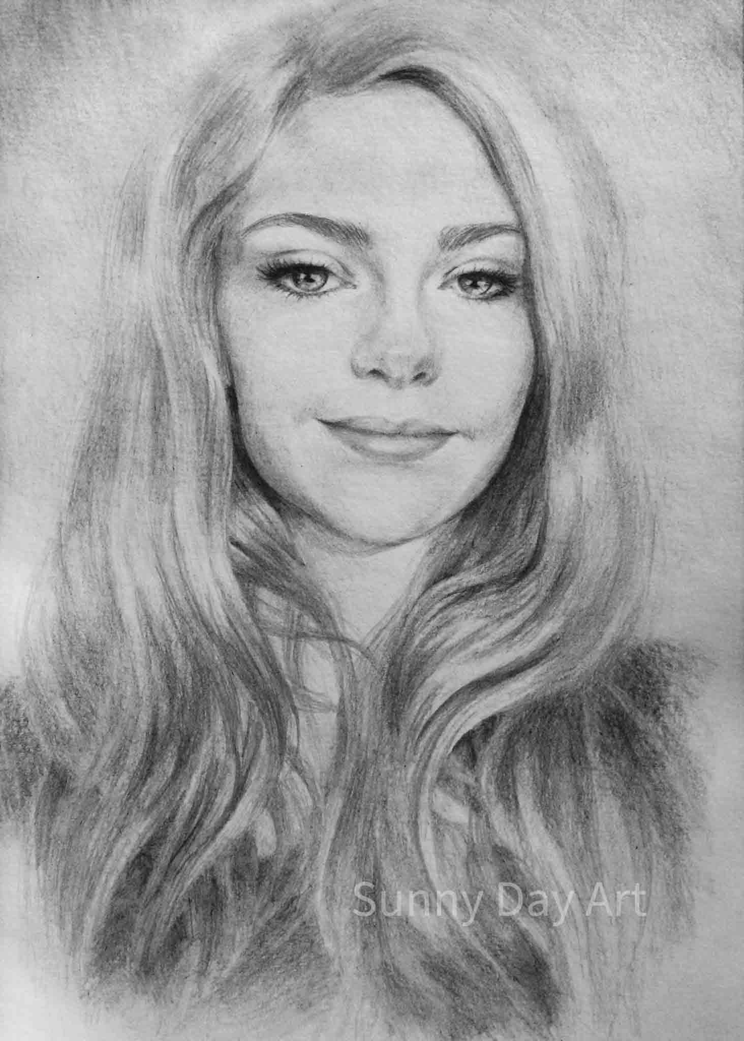 Portrait of a light-haired girl with a confident gaze and sparkling eyes.