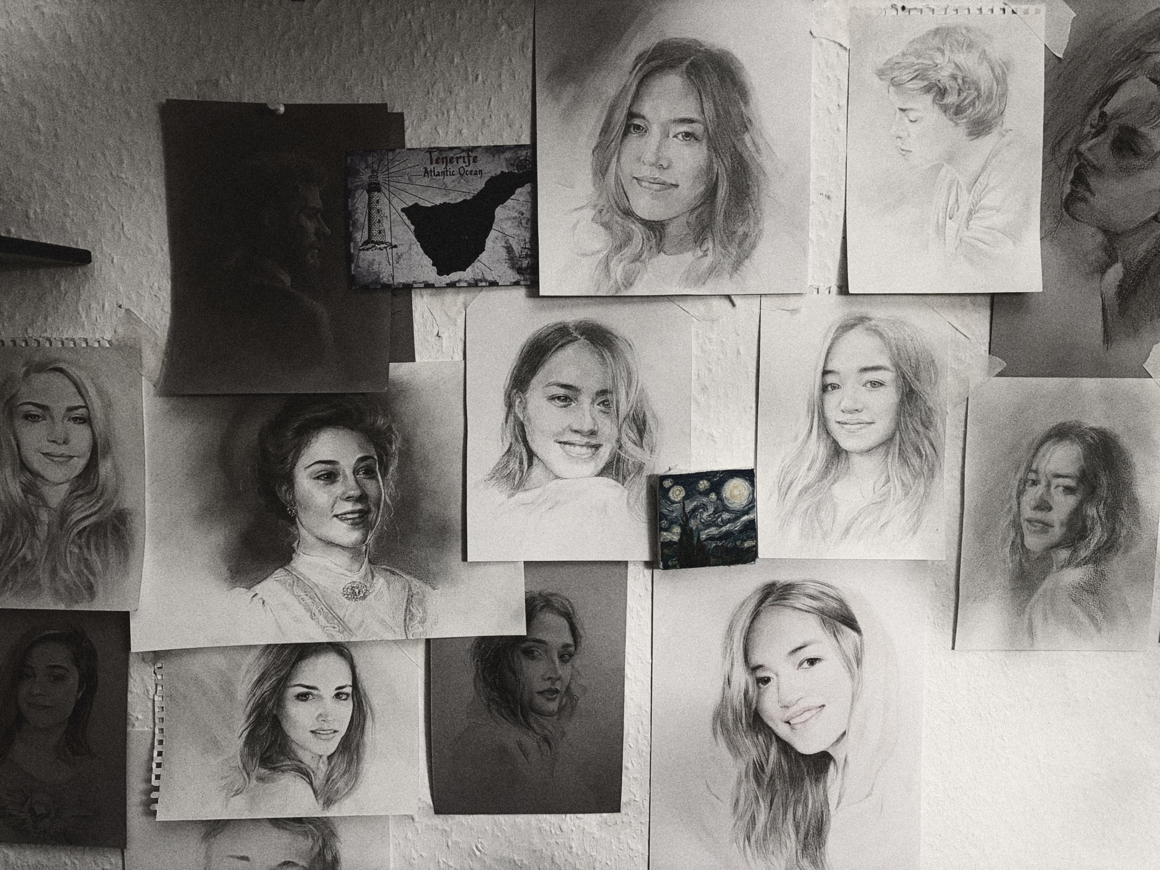 Wall with hand-drawn pencil portraits